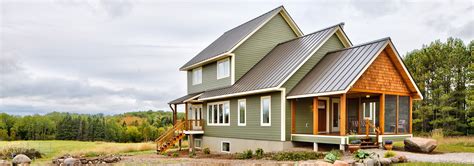 green metal roof grey house|farmhouse with green metal roof.